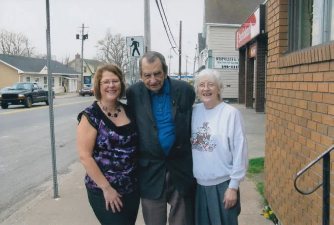 Danalee Stone, Dan Thompson and Loreen Thompson outside the office in Westville