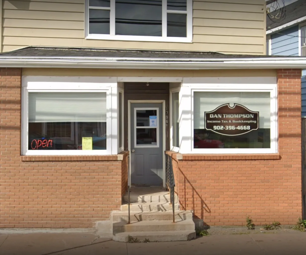 Dan Thompson Income Tax storefront on Main St N, Westville